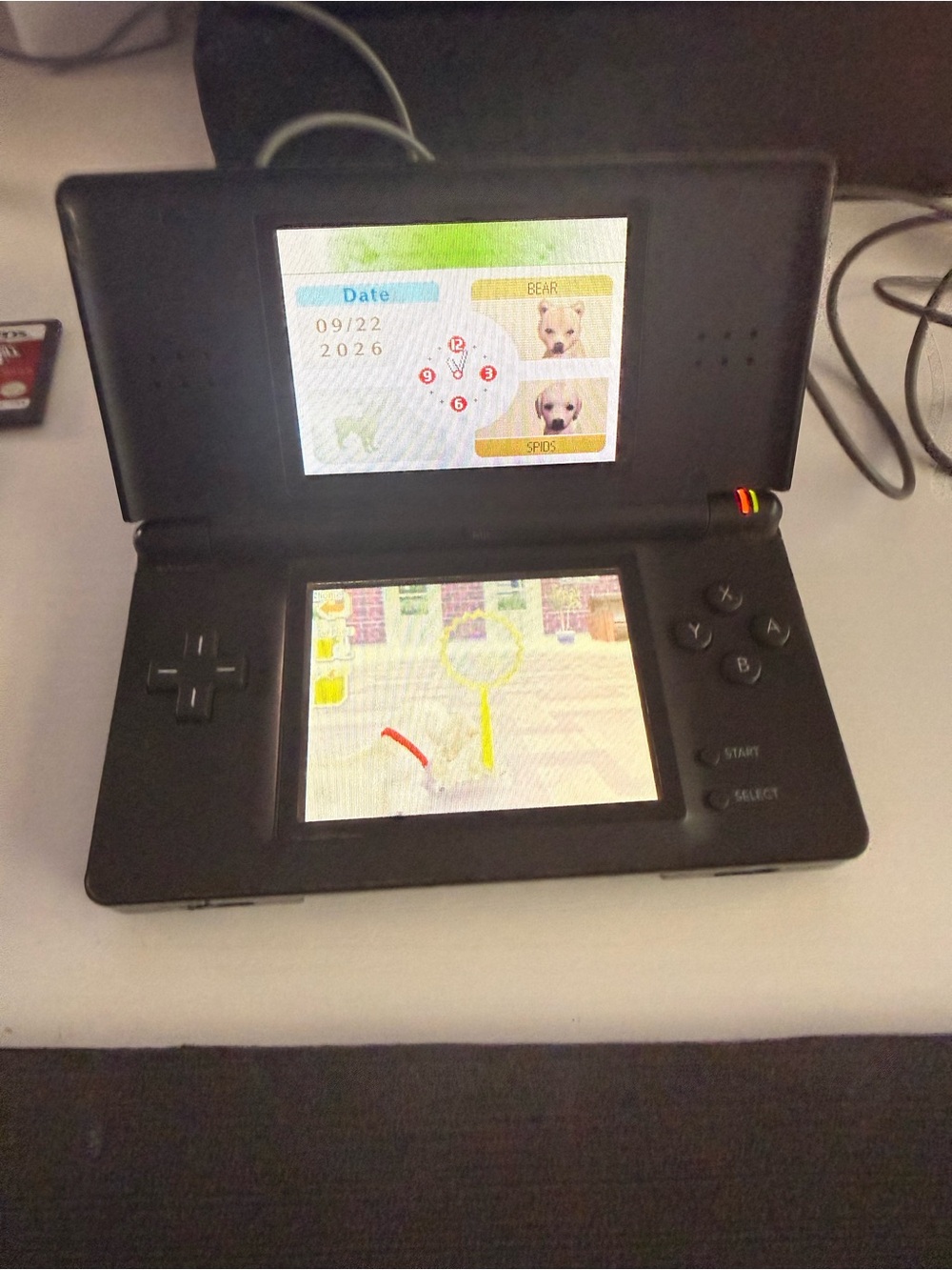 Nintendo DS Lite Handheld Console - Black with 4 games.